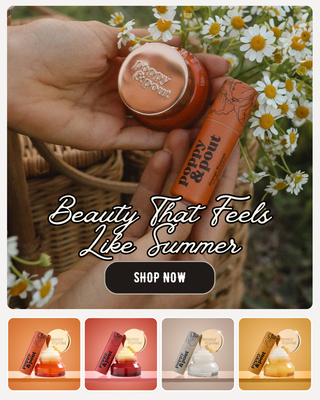 Hand holding a cosmetic product with 'Poppy & Point' branding, surrounded by flowers and a basket.